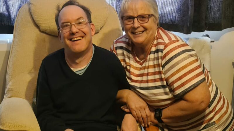 Two people sitting in armchairs.