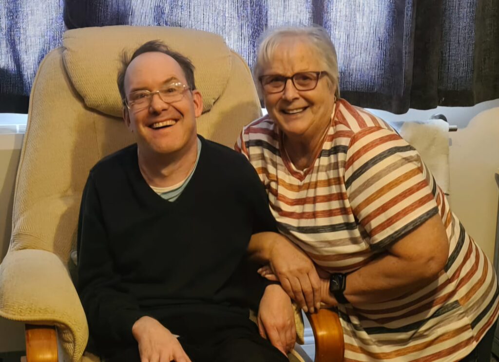 Two people sitting in armchairs.