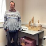 James with his model at Linkage Choices Lincoln.