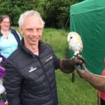 Liam holding a barn owl while on a trip with Linkage Choices Toynton.